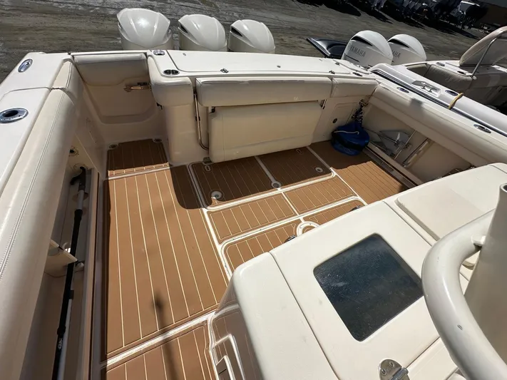  Yacht Photos Pics 2018 Grady-White Canyon 336 boat deck with seating and outboard motors.