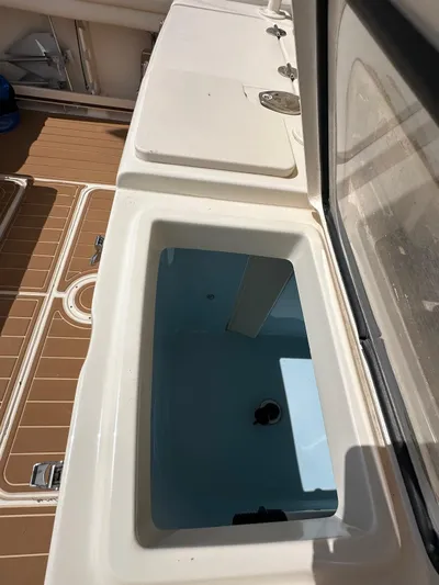  Yacht Photos Pics 2018 Grady-White Canyon 336 boat interior with open storage compartment.