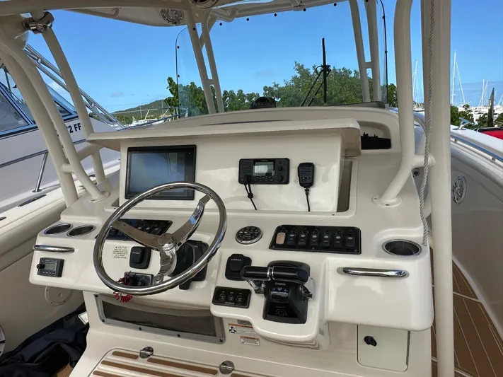 Yacht Photos Pics 2018 Grady-White Canyon 336 helm with steering wheel, controls, and navigation equipment.