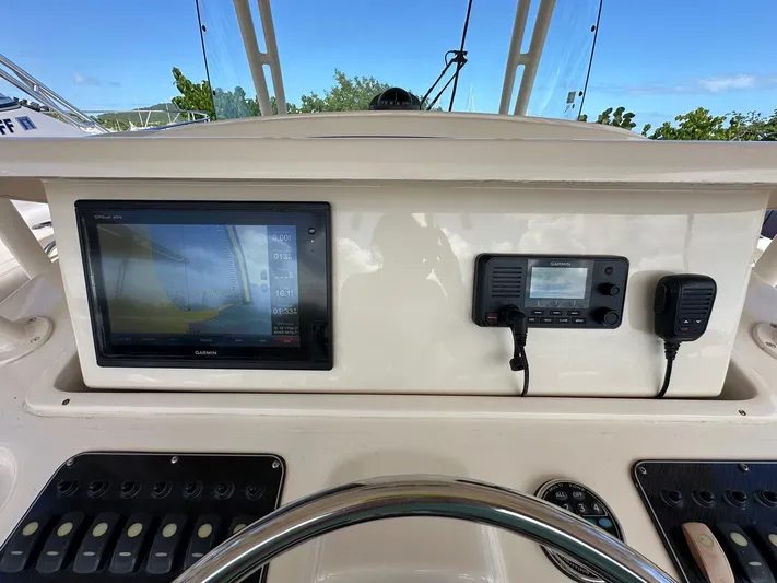  Yacht Photos Pics Control panel of 2018 Grady-White Canyon 336 boat with navigation and communication systems.