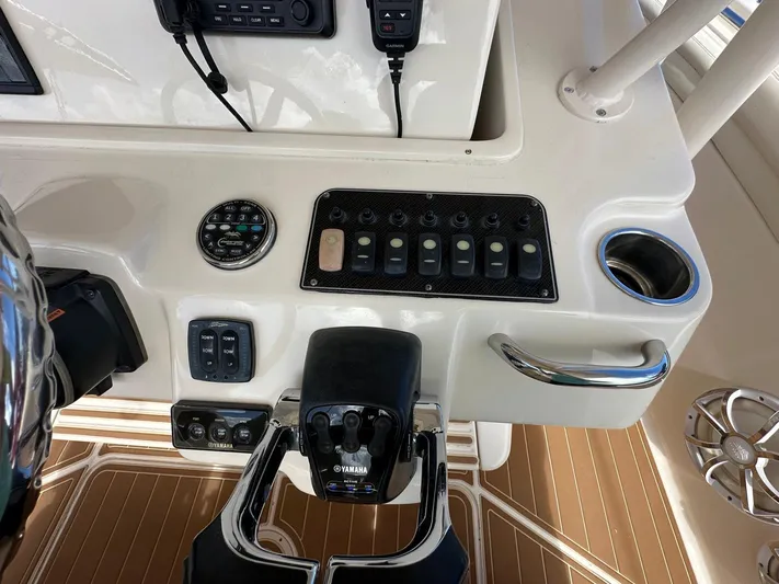  Yacht Photos Pics Control panel of a 2018 Grady-White Canyon 336 boat, featuring various switches and controls.
