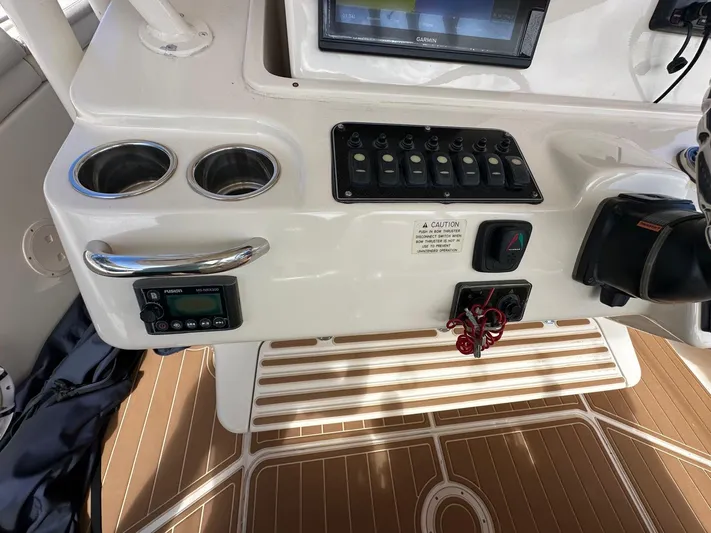  Yacht Photos Pics 2018 Grady-White Canyon 336 boat dashboard with controls and cup holders.