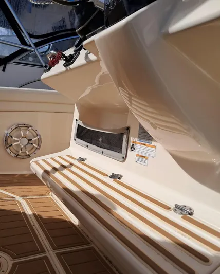  Yacht Photos Pics 2018 Grady-White Canyon 336 boat interior with teak flooring and seating area.