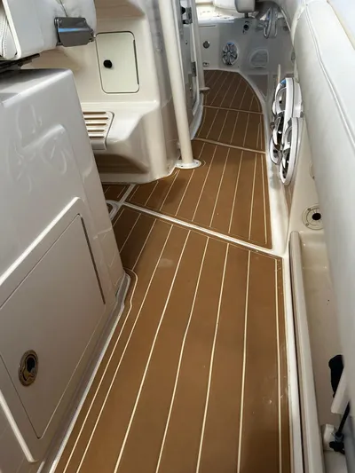  Yacht Photos Pics 2018 Grady-White Canyon 336 boat interior with brown flooring and white cabinetry.