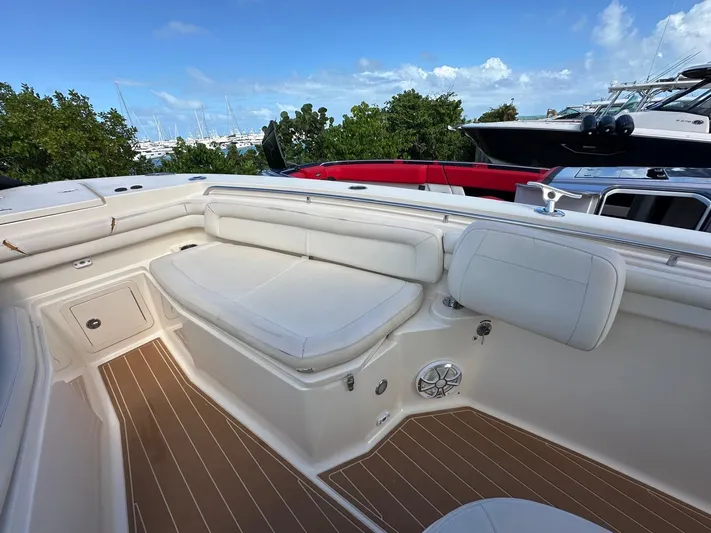  Yacht Photos Pics 2018 Grady-White Canyon 336 boat interior with white seating and wood flooring.
