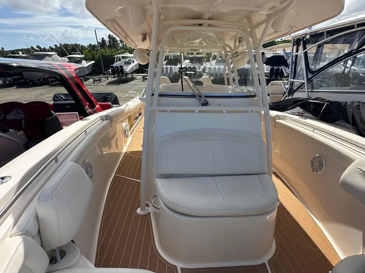  Yacht Photos Pics 2018 Grady-White Canyon 336 boat interior with seating and helm station.