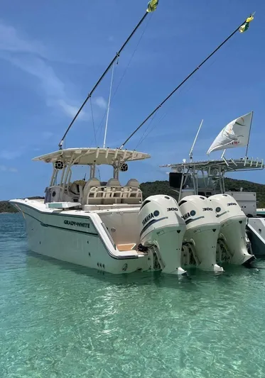  Yacht Photos Pics 2018 Grady-White Canyon 336 boat with triple Yamaha engines in clear blue water.