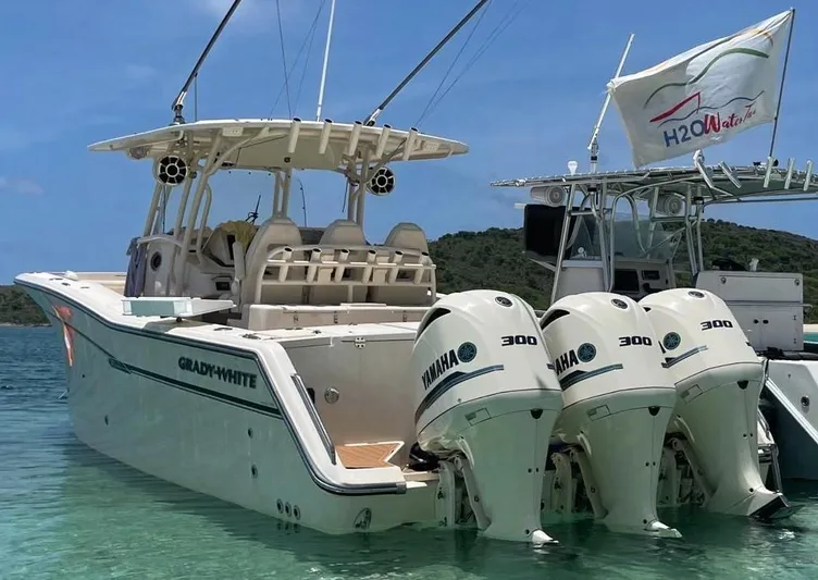  Yacht Photos Pics 2018 Grady-White Canyon 336 boat with triple Yamaha 300 engines in clear water.