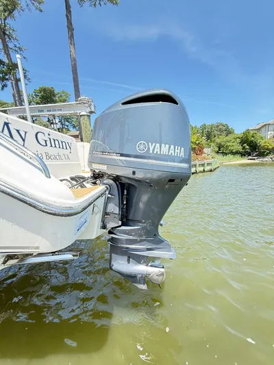 My Ginny Yacht Photos Pics 2014 Pursuit ST 310 Sport with Yamaha outboard motor on a sunny day.