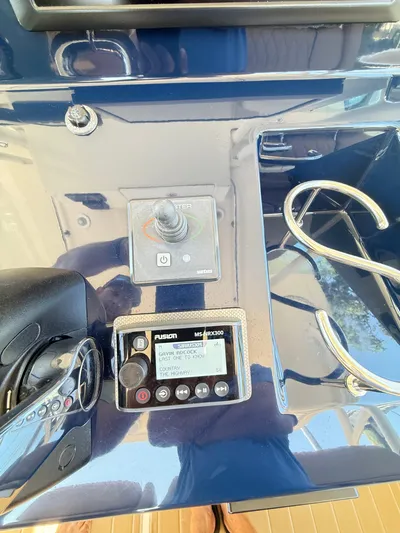 My Ginny Yacht Photos Pics Control panel of a 2014 Pursuit ST 310 Sport boat with audio system and throttle.