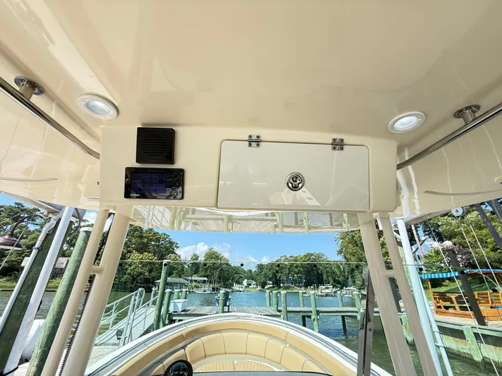 My Ginny Yacht Photos Pics 2014 Pursuit ST 310 Sport boat interior with console and scenic marina view.