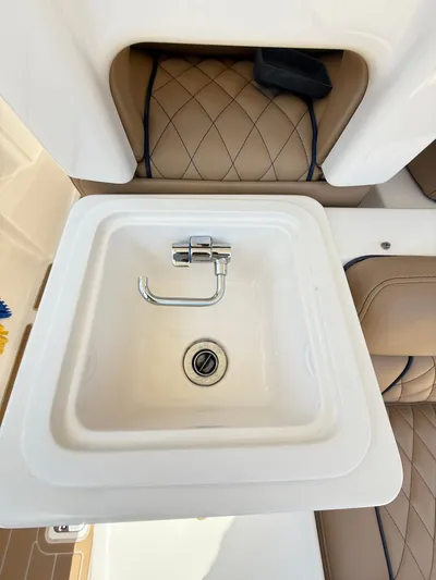 My Ginny Yacht Photos Pics 2014 Pursuit ST 310 Sport boat sink with quilted leather seating.