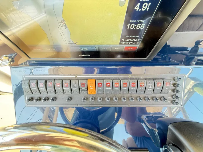 My Ginny Yacht Photos Pics Control panel of a 2014 Pursuit ST 310 Sport boat with Garmin navigation display.