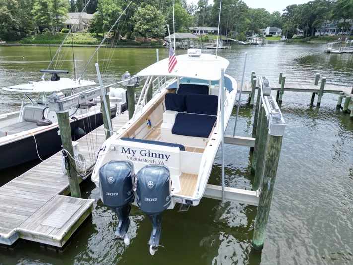 My Ginny Yacht Photos Pics 2014 Pursuit ST 310 Sport boat docked with twin engines, named "My Ginny," Virginia Beach.