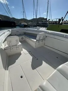  Yacht Photos Pics 2017 Invincible 39 Open Fisherman boat interior with seating and storage, docked in a marina.