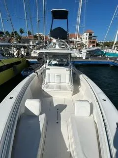  Yacht Photos Pics 2017 Invincible 39 Open Fisherman boat docked in marina, clear sky background.