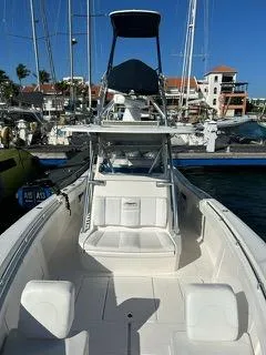  Yacht Photos Pics 2017 Invincible 39 Open Fisherman boat docked at marina under clear blue sky.