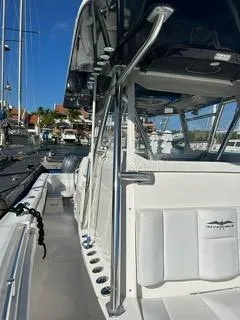  Yacht Photos Pics 2017 Invincible 39 Open Fisherman boat docked at marina, showcasing sleek design and spacious deck.