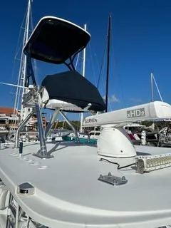  Yacht Photos Pics 2017 Invincible 39 Open Fisherman boat with radar and canopy, docked in a marina.