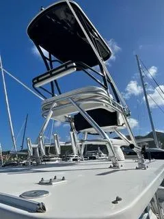  Yacht Photos Pics 2017 Invincible 39 Open Fisherman boat with tower against blue sky.