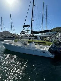  Yacht Photos Pics 2017 Invincible 39 Open Fisherman boat docked in a sunny marina.