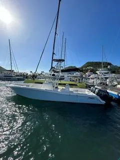  Yacht Photos Pics 2017 Invincible 39 Open Fisherman boat docked in a sunny marina.