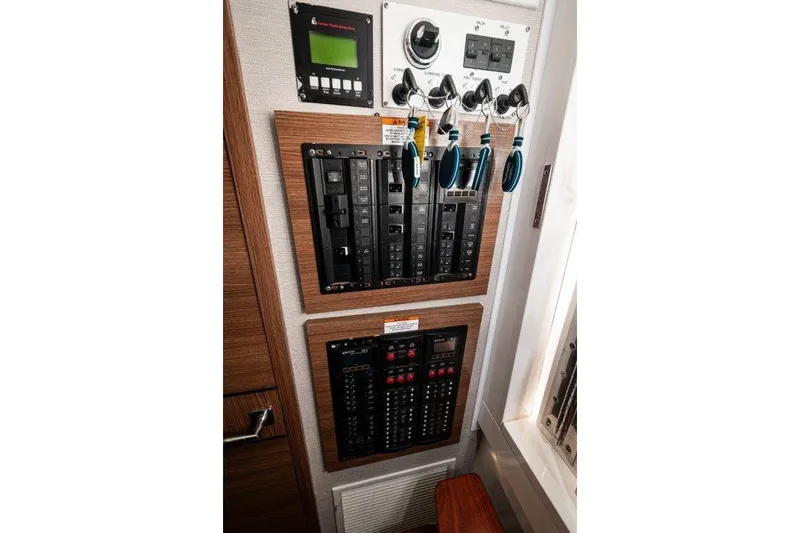  Yacht Photos Pics Electrical control panel on 2021 Valhalla Boatworks V-46, featuring switches and circuit breakers.