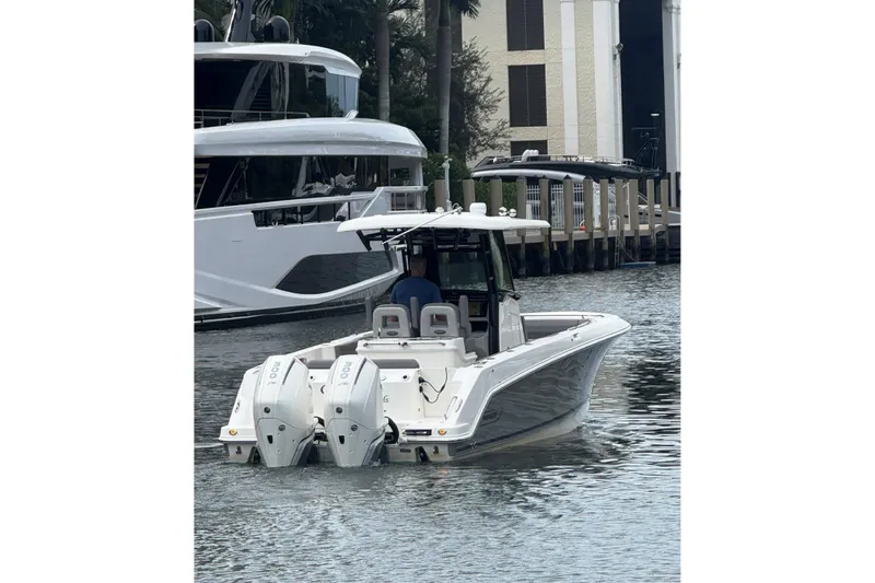  Yacht Photos Pics 2024 Boston Whaler 280 Outrage boat with dual engines on the water.