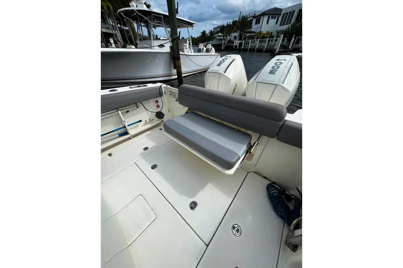  Yacht Photos Pics 2024 Boston Whaler 280 Outrage boat interior with seating and twin engines.