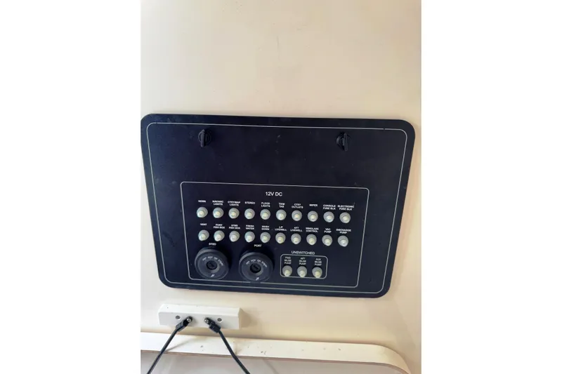  Yacht Photos Pics Control panel of 2024 Boston Whaler 280 Outrage boat, featuring various switches and outlets.