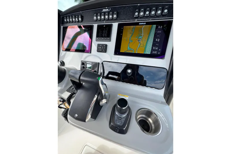  Yacht Photos Pics 2024 Boston Whaler 280 Outrage dashboard with advanced navigation and control systems.