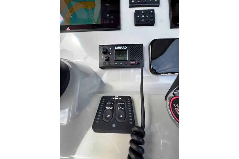 Yacht Photos Pics 2024 Boston Whaler 280 Outrage dashboard with Simrad and Lenco controls.