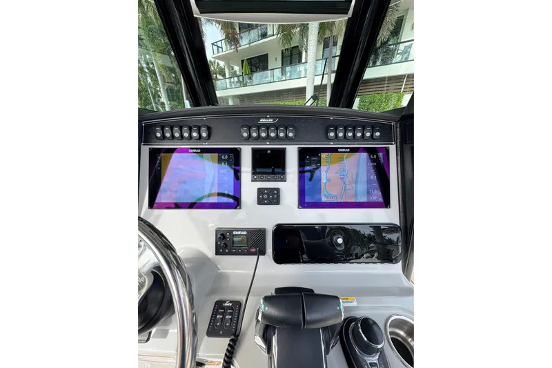  Yacht Photos Pics 2024 Boston Whaler 280 Outrage dashboard with advanced navigation displays and controls.