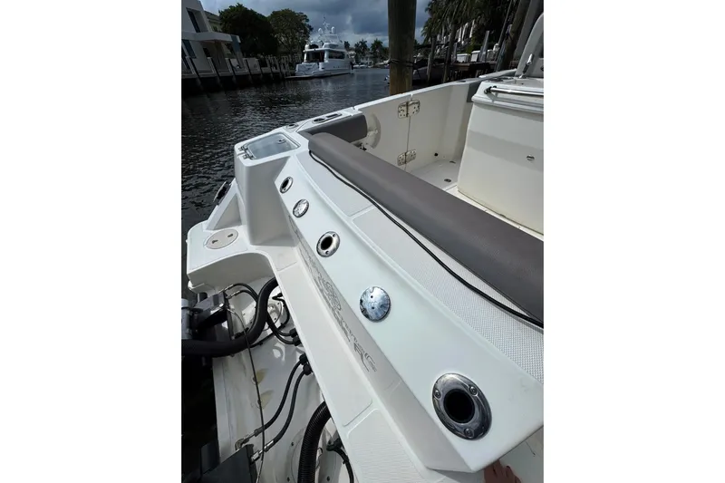  Yacht Photos Pics 2024 Boston Whaler 280 Outrage boat interior with seating and rod holders.