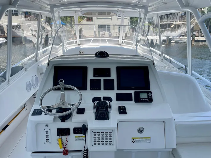  Yacht Photos Pics 2015 Intrepid 375 Walkaround boat helm with modern navigation equipment.