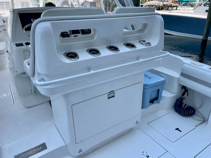  Yacht Photos Pics 2015 Intrepid 375 Walkaround boat interior with rod holders and storage compartments.