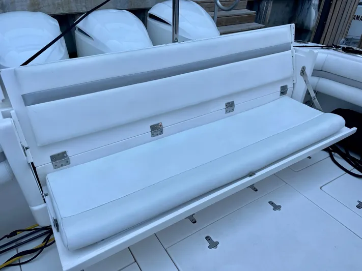  Yacht Photos Pics 2015 Intrepid 375 Walkaround boat with white cushioned seating.