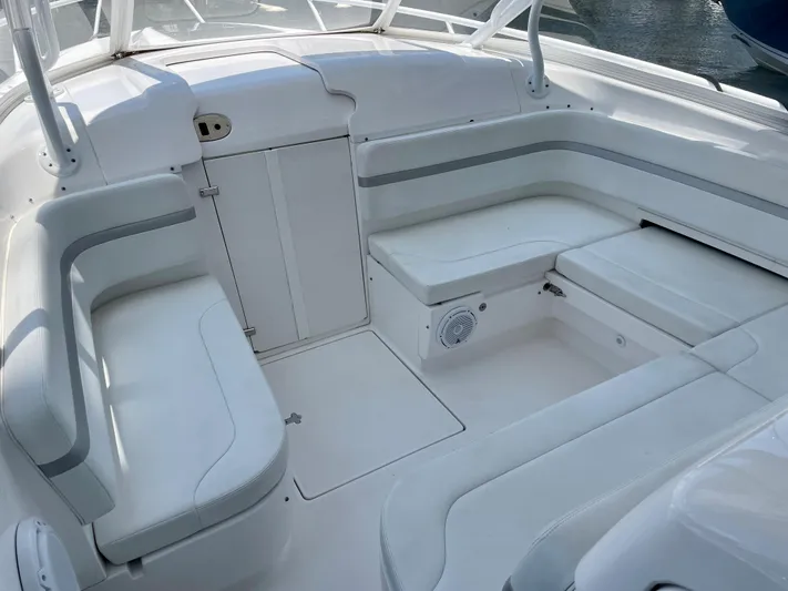  Yacht Photos Pics 2015 Intrepid 375 Walkaround boat interior with white seating and storage compartments.