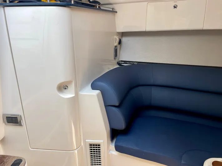  Yacht Photos Pics Interior of a 2015 Intrepid 375 Walkaround boat with blue seating.