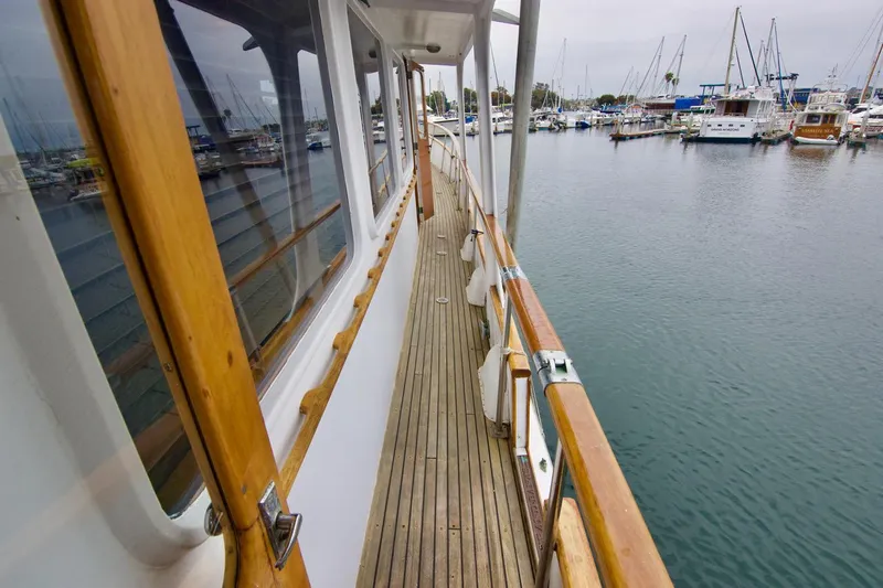 Grand Times Yacht Photos Pics Side deck view of a 1969 Grand Banks Classic yacht in a marina.