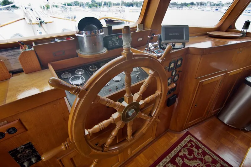 Grand Times Yacht Photos Pics 1969 Grand Banks Classic yacht helm with wooden wheel and navigation instruments.