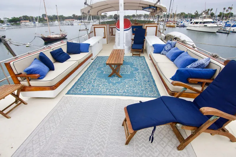 Grand Times Yacht Photos Pics Luxurious 1969 Grand Banks Classic yacht deck with blue cushions and elegant seating.