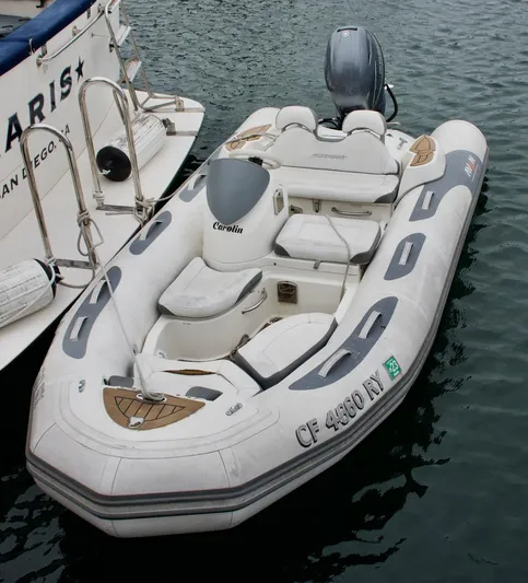Grand Times Yacht Photos Pics Inflatable boat docked beside a Grand Banks Classic yacht, 1969 model.