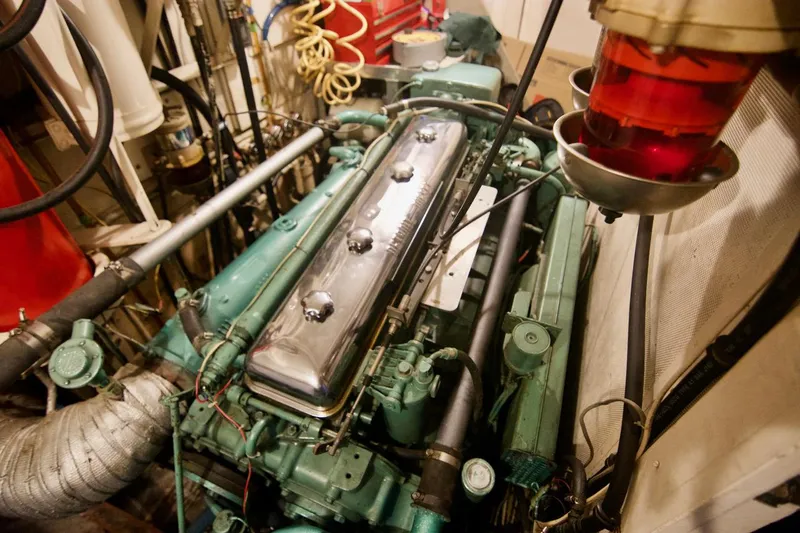 Grand Times Yacht Photos Pics Engine room of a 1969 Grand Banks Classic boat, showcasing vintage machinery and components.