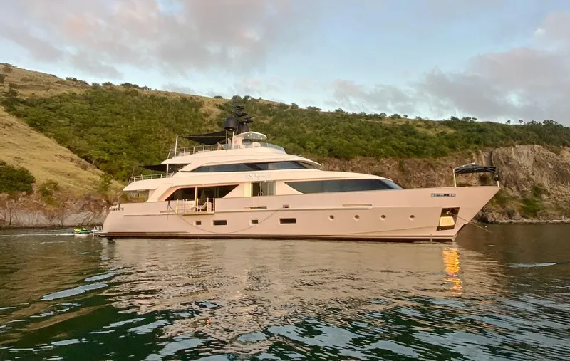 Halcyon Yacht Photos Pics Sanlorenzo SD112 yacht, 2018 model, anchored near a scenic coastline.