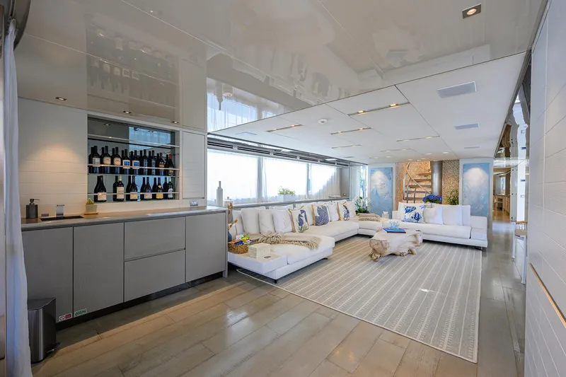 Halcyon Yacht Photos Pics Luxurious interior of 2018 Sanlorenzo SD112 yacht with modern decor and elegant seating area.