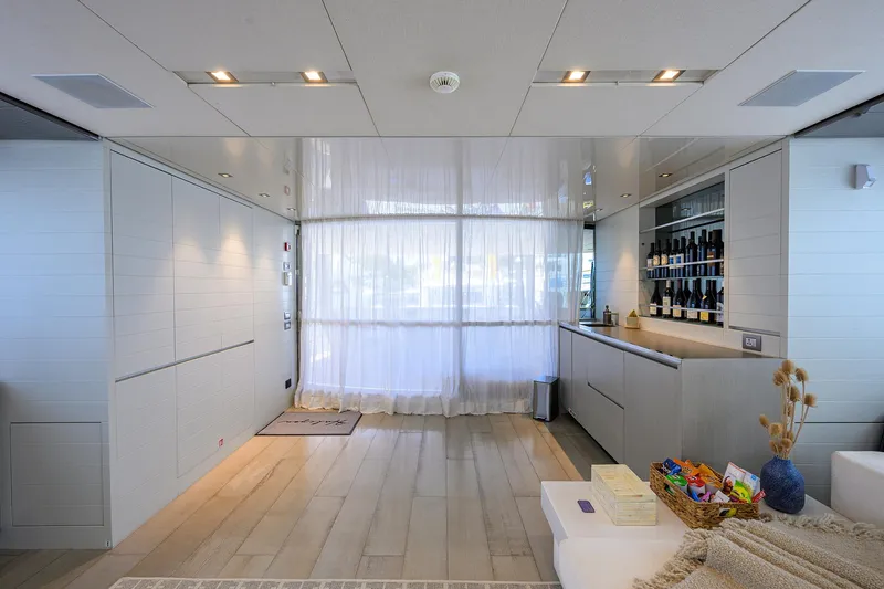 Halcyon Yacht Photos Pics Luxurious interior of 2018 Sanlorenzo SD112 yacht with modern bar and elegant decor.
