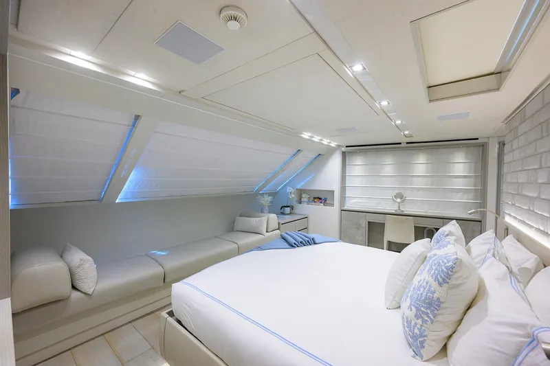Halcyon Yacht Photos Pics Luxurious bedroom interior of 2018 Sanlorenzo SD112 yacht with modern decor and ample natural light.