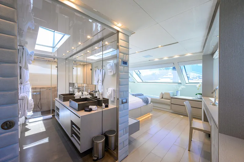 Halcyon Yacht Photos Pics Luxurious interior of 2018 Sanlorenzo SD112 yacht, featuring modern bedroom and bathroom design.