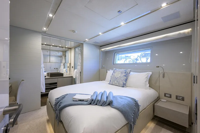 Halcyon Yacht Photos Pics Luxurious bedroom interior of 2018 Sanlorenzo SD112 yacht with modern design and elegant decor.
